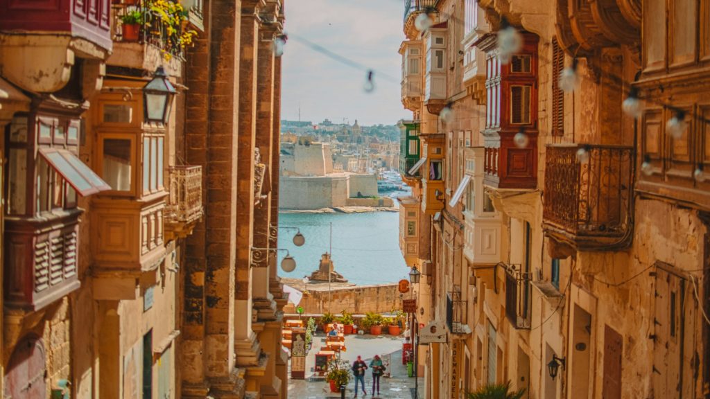 View down a street on to the harbour in Valetta Malta, one of the best places to go in Europe in February