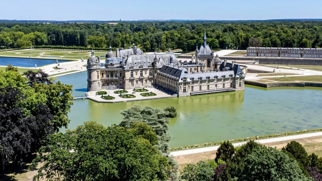 Chateau de Chantilly - France the castle sits surrounded by water. Part of a road trip from Amsterdam to Paris