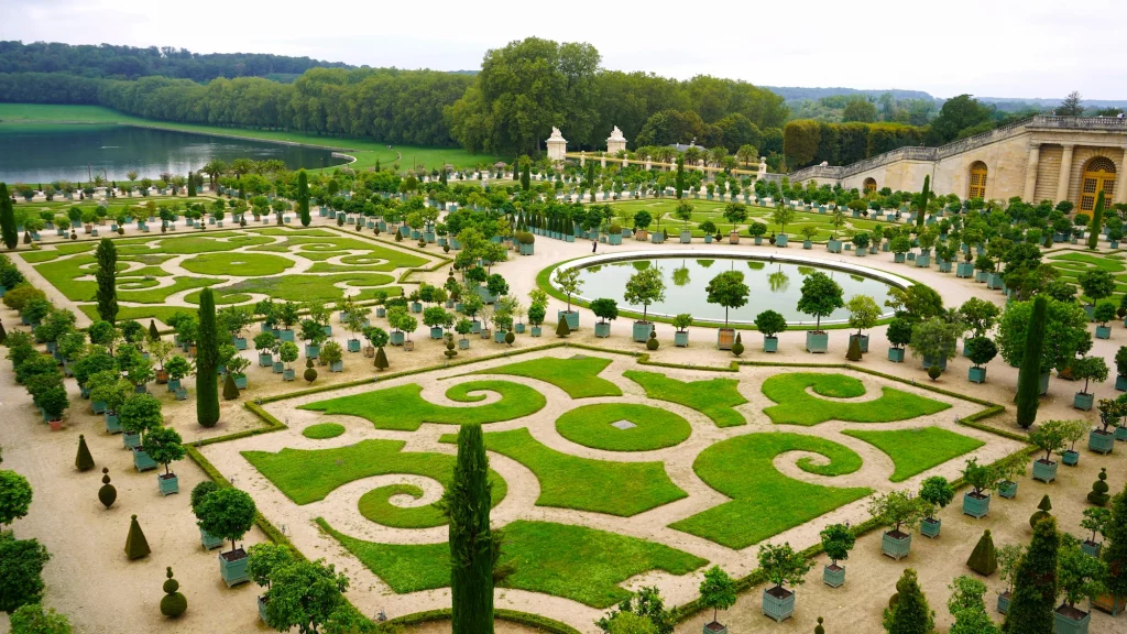 A view of the parterres in the Gardens at Versailles - France
